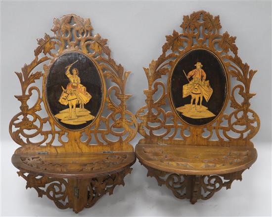 A pair of carved Sorrento style wall brackets